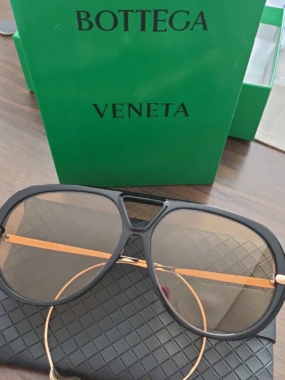 Bottega Veneta Black Frame Sunglasses with Gold Temples
